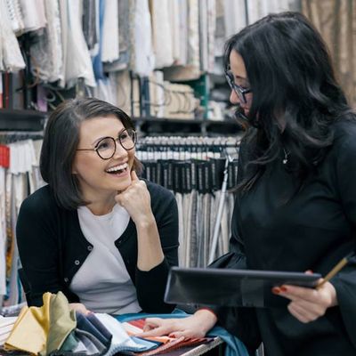 Two Women Working With Interior Fabrics — Tallahassee, FL — Jones Upholstery LLC