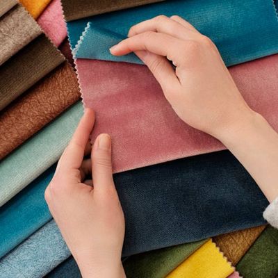 Young Woman With Fabrics At Table — Tallahassee, FL — Jones Upholstery LLC